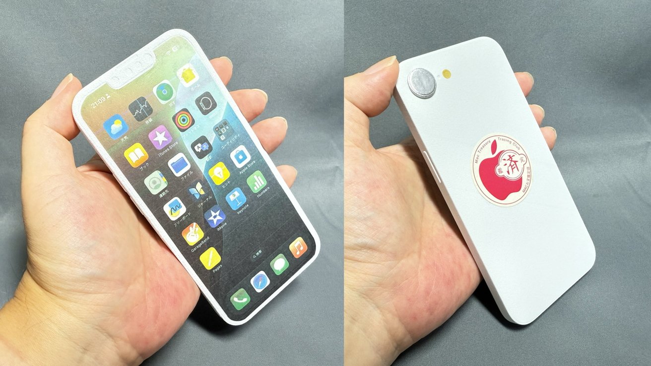 A hand holds a paper cutout resembling a smartphone, showing app icons on the front and a red sticker on the back.