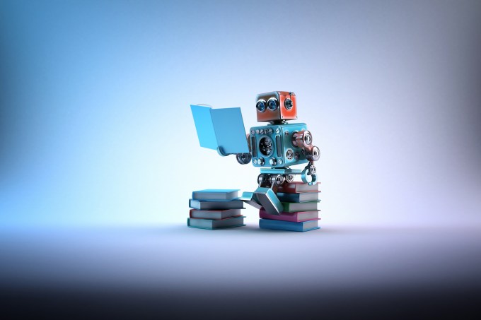 Robot sitting on a bunch of books