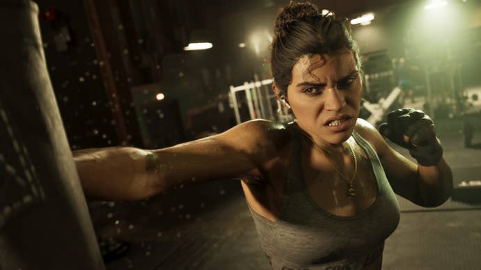 Close up of Lucia from GTA 6 punching a punching bag with gritted teeth